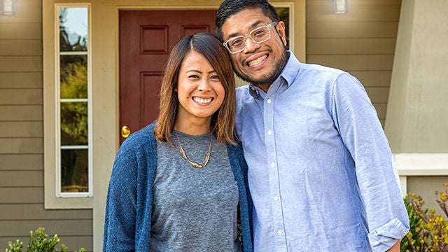 couple in front of home